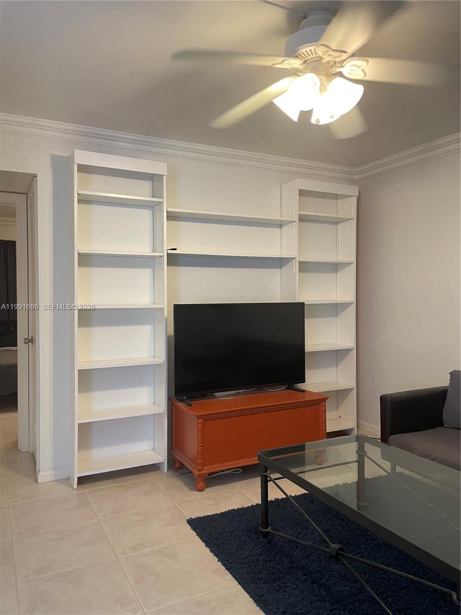 1405 Miami Road, Unit 23 Fort Lauderdale, FL 33316 - Photo 11 of 20 a living room with furniture and a flat screen tv