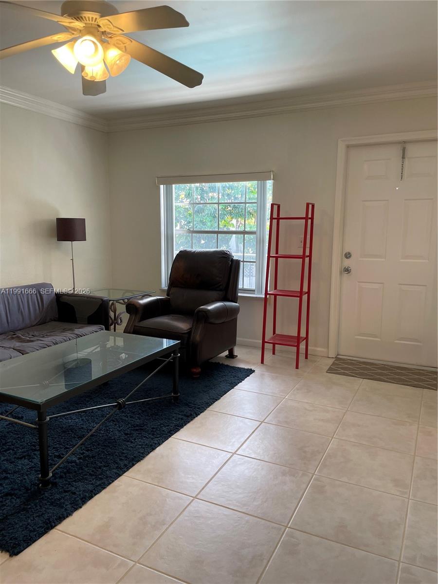 1405 Miami Road, Unit 23 Fort Lauderdale, FL 33316 - Photo 12 of 20 a living room with furniture and a flat screen tv