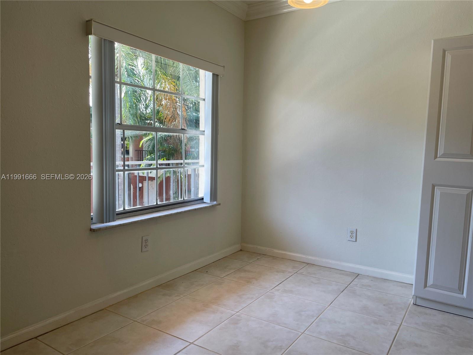 1405 Miami Road, Unit 23 Fort Lauderdale, FL 33316 - Photo 14 of 20 a view of an empty room with a window