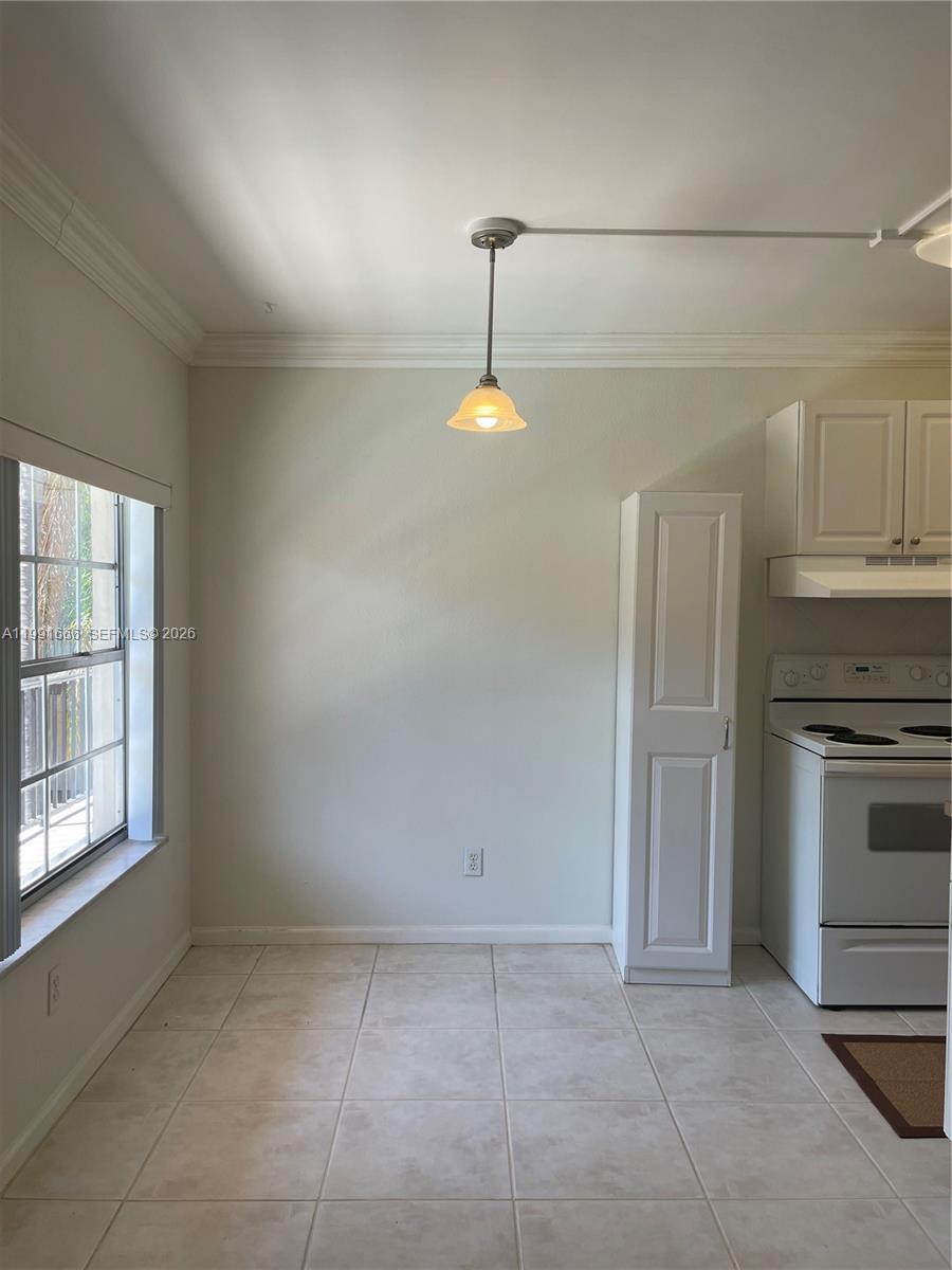 1405 Miami Road, Unit 23 Fort Lauderdale, FL 33316 - Photo 15 of 20 a kitchen with a stove and a refrigerator