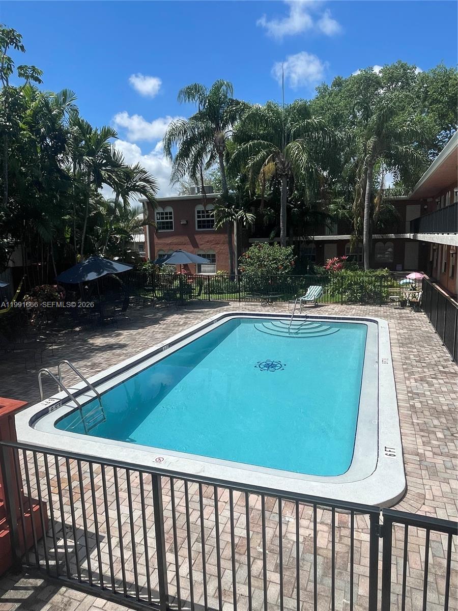 1405 Miami Road, Unit 23 Fort Lauderdale, FL 33316 - Photo 18 of 20 a view of a swimming pool with a patio