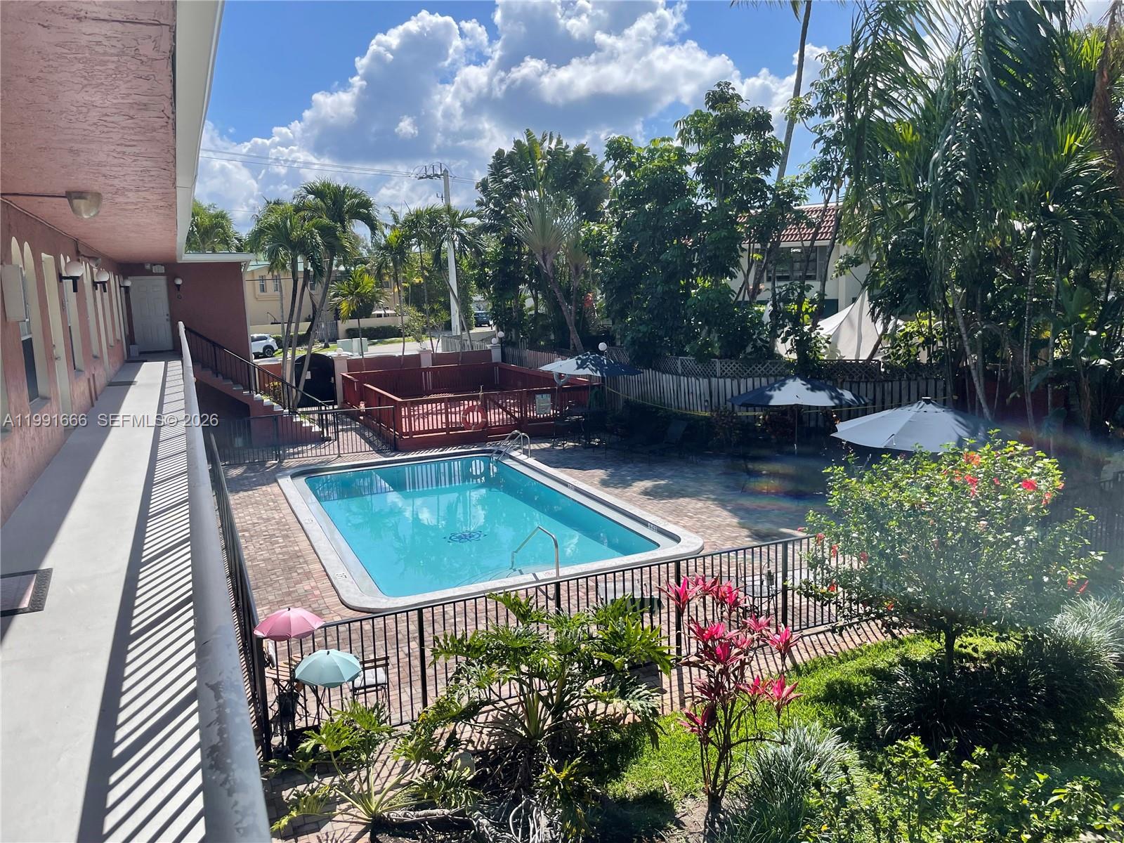1405 Miami Road, Unit 23 Fort Lauderdale, FL 33316 - Photo 3 of 20 a view of a backyard with sitting area and furniture