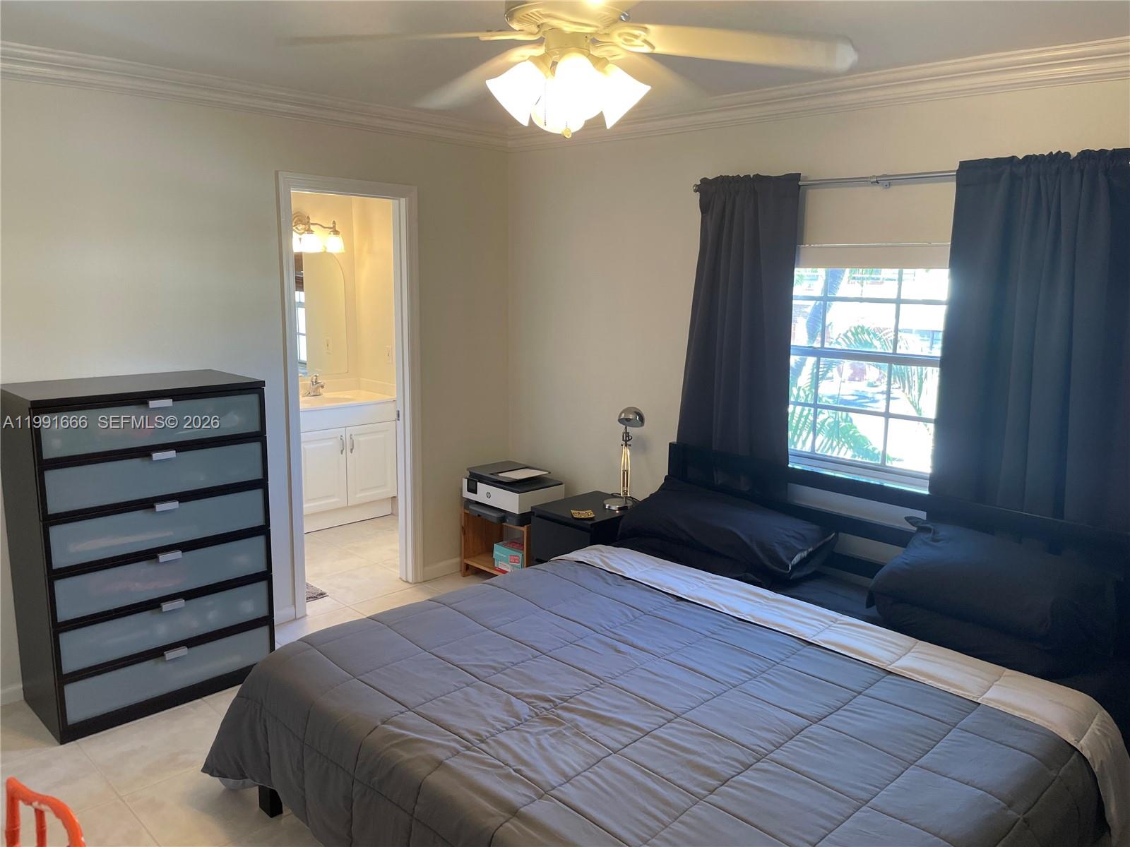 1405 Miami Road, Unit 23 Fort Lauderdale, FL 33316 - Photo 7 of 20 a bedroom with a bed and a window