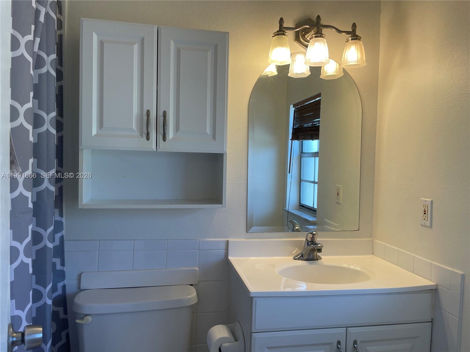 1405 Miami Road, Unit 23 Fort Lauderdale, FL 33316 - Photo 10 of 20 a bathroom with a sink vanity and toilet