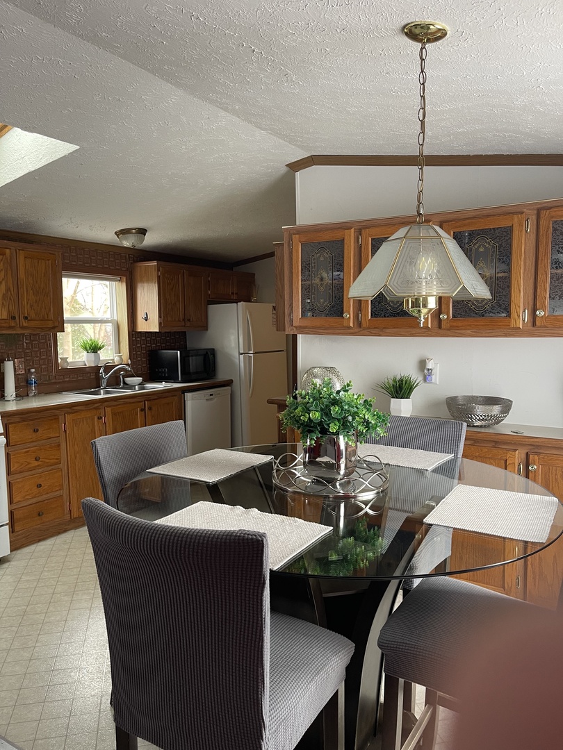 365 Surrey Road Wheeling, IL 60090 - Photo 3 of 12 a living room with furniture and a chandelier