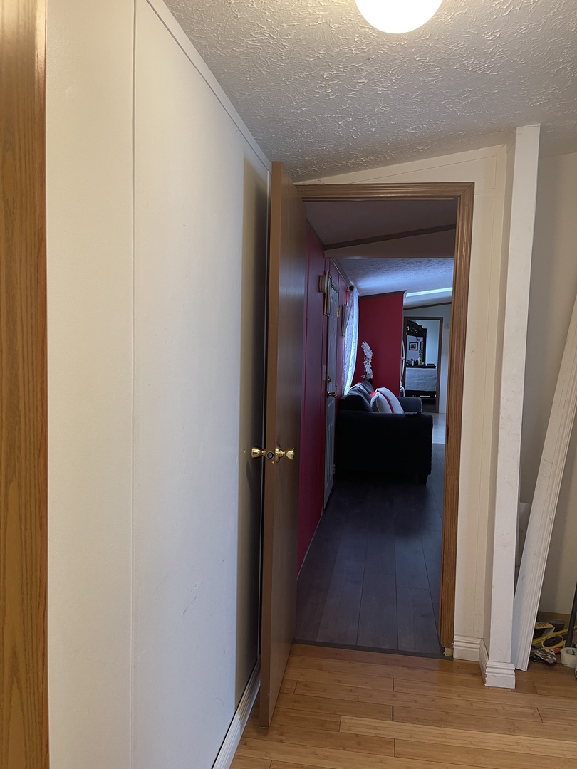 365 Surrey Road Wheeling, IL 60090 - Photo 8 of 12 a view of a hallway and wooden floor