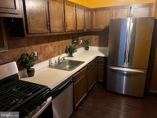 1836 Metzerott Road, Unit 1224 Hyattsville, MD 20783 - Photo 2 of 17 a kitchen with a sink and refrigerator