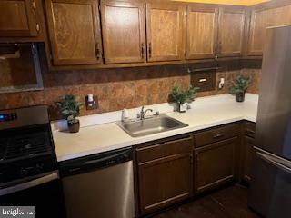 1836 Metzerott Road, Unit 1224 Hyattsville, MD 20783 - Photo 3 of 17 a kitchen with a sink and cabinets