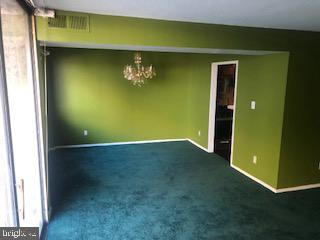 1836 Metzerott Road, Unit 1224 Hyattsville, MD 20783 - Photo 4 of 17 a view of an empty room with a fireplace