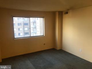 1836 Metzerott Road, Unit 1224 Hyattsville, MD 20783 - Photo 6 of 17 a view of an empty room with a window