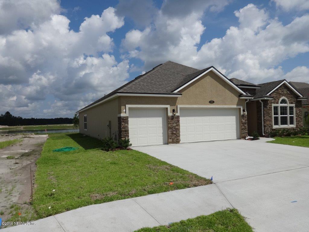 316 Crescent Key Drive St. Augustine, FL 32086 - Photo 13 of 45 a front view of a house with garden