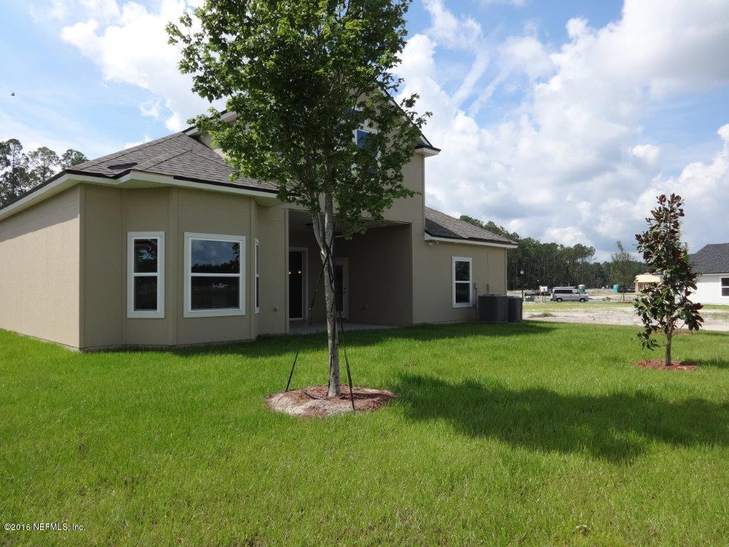 316 Crescent Key Drive St. Augustine, FL 32086 - Photo 18 of 45 a view of a backyard of the house