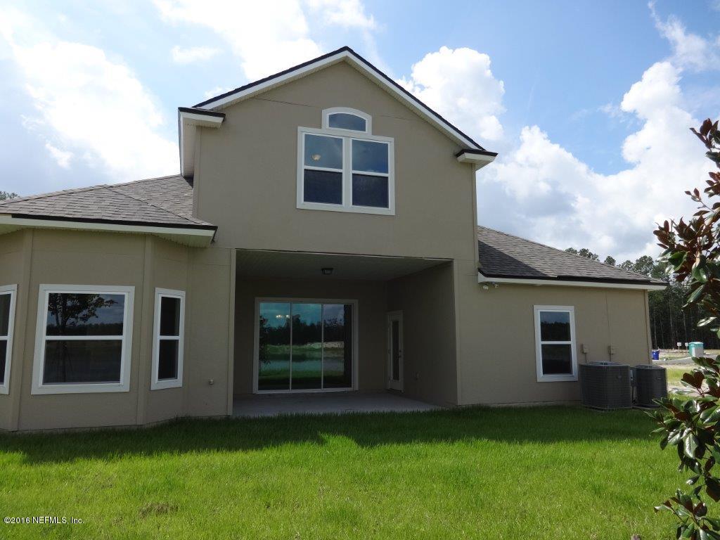 316 Crescent Key Drive St. Augustine, FL 32086 - Photo 19 of 45 a view of backyard of a house