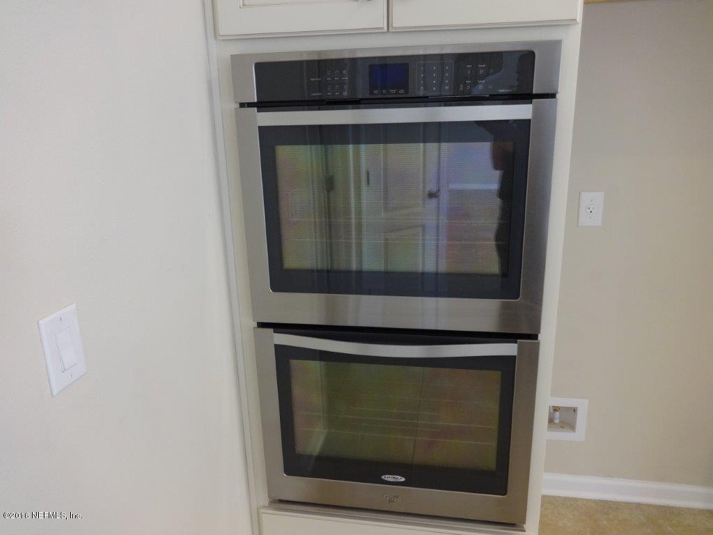 316 Crescent Key Drive St. Augustine, FL 32086 - Photo 35 of 45 a closeup stove top oven