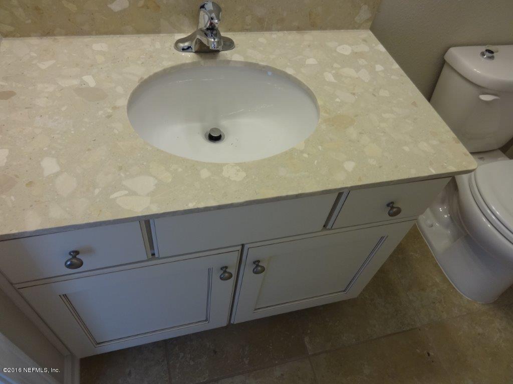 316 Crescent Key Drive St. Augustine, FL 32086 - Photo 37 of 45 a bathroom with a sink and toilet