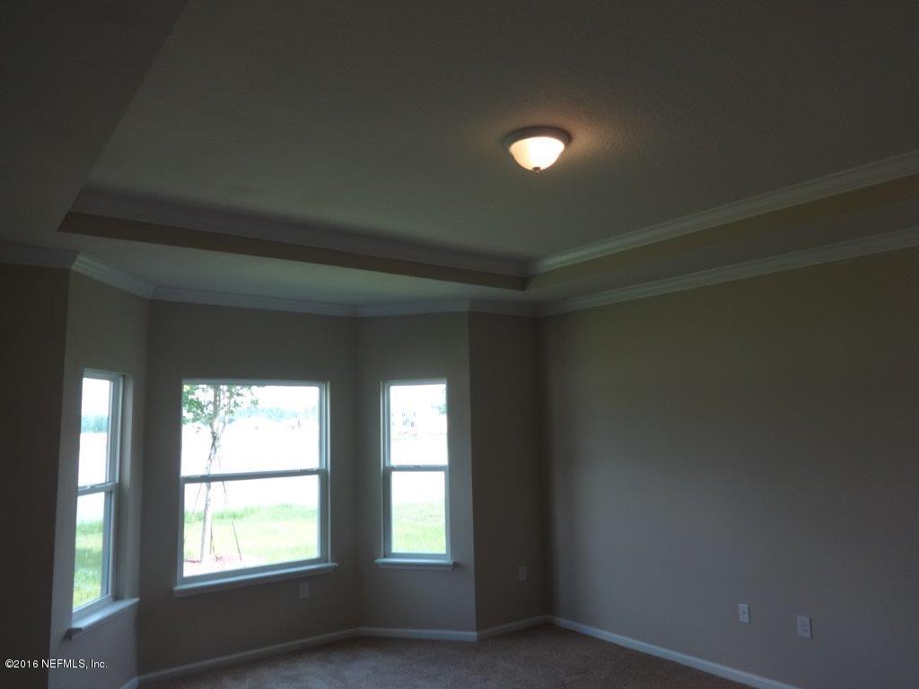 316 Crescent Key Drive St. Augustine, FL 32086 - Photo 38 of 45 a view of an empty room with a window