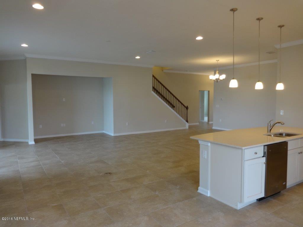 316 Crescent Key Drive St. Augustine, FL 32086 - Photo 42 of 45 a view of a kitchen with a sink and dishwasher with kitchen view
