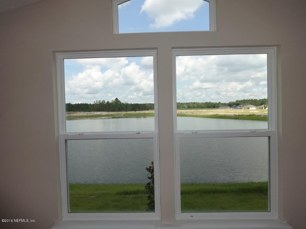 316 Crescent Key Drive St. Augustine, FL 32086 - Photo 43 of 45 a view of a glass door and a window