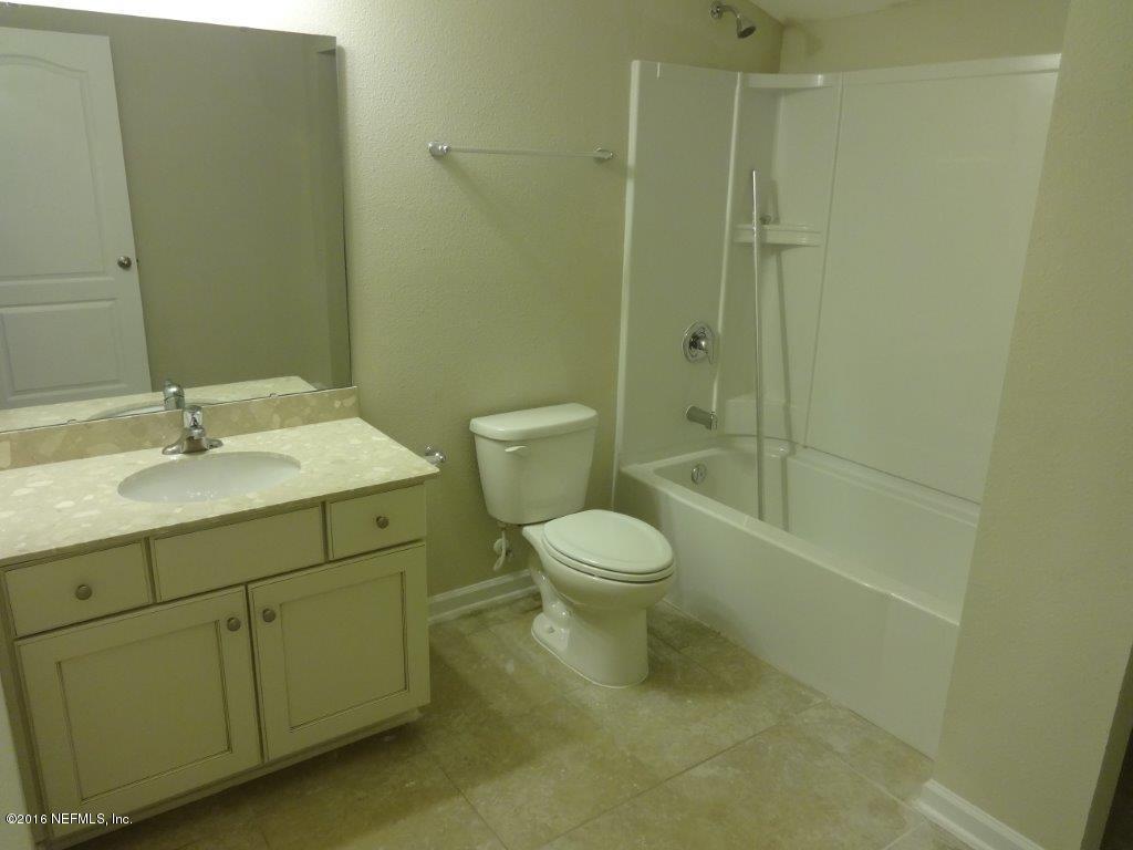 316 Crescent Key Drive St. Augustine, FL 32086 - Photo 45 of 45 a bathroom with a sink a toilet and shower