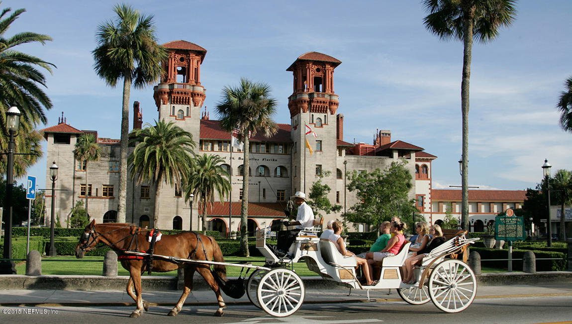 316 Crescent Key Drive St. Augustine, FL 32086 - Photo 9 of 45 a front view of a building with palm trees