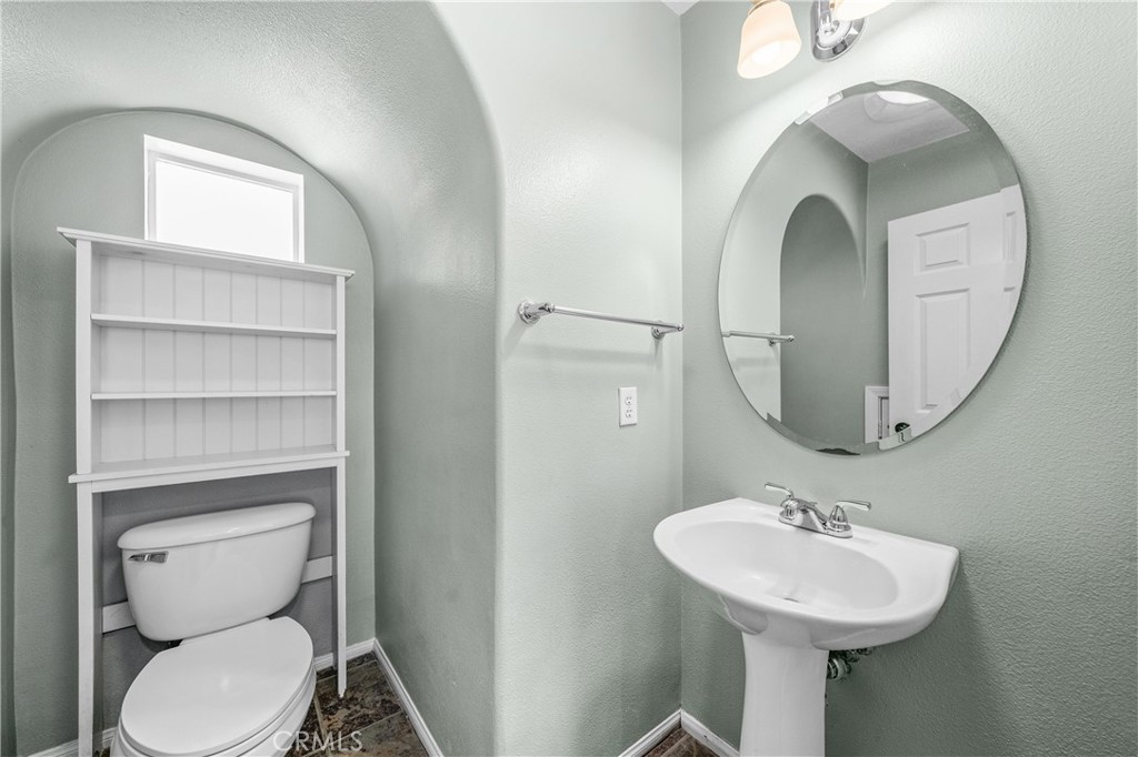 25 Amy Way Ladera Ranch, CA 92694 - Photo 11 of 47 a bathroom with a toilet sink and mirror