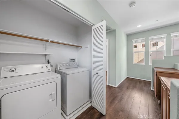 a view of storage and utility room with washer and dryer