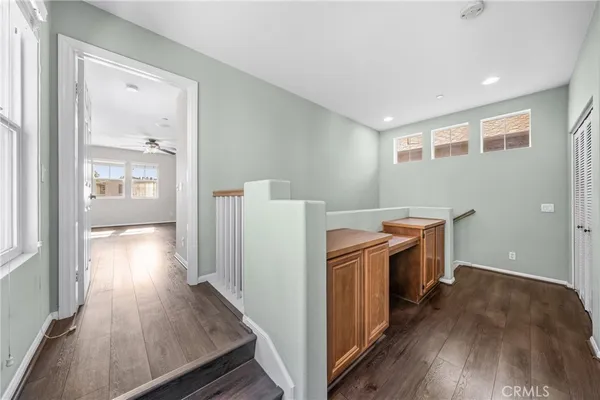 a view of a kitchen with wooden floor