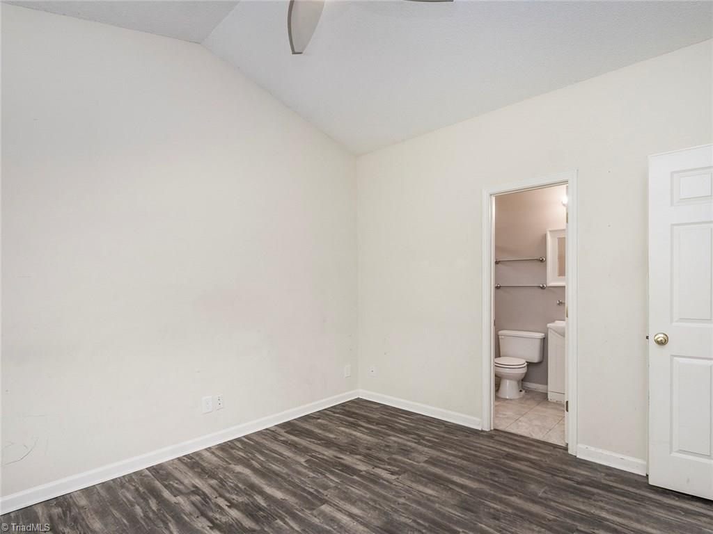 4705 Fewell Road Greensboro, NC 27405 - Photo 10 of 23 The master offers a master bath and vaulted ceilings.