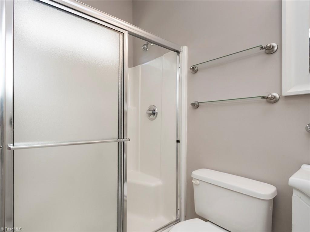 4705 Fewell Road Greensboro, NC 27405 - Photo 12 of 23 The master bath offers a stand alone shower.