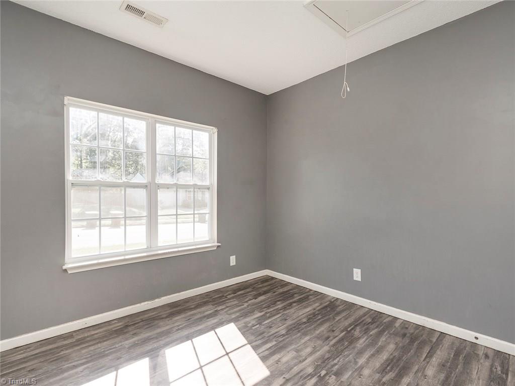 4705 Fewell Road Greensboro, NC 27405 - Photo 14 of 23 The 2nd bedroom offers great space and the windows bring in great natural light.