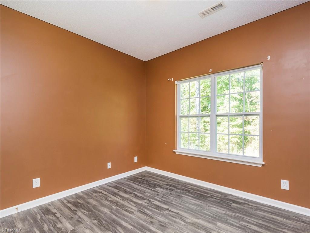 4705 Fewell Road Greensboro, NC 27405 - Photo 16 of 23 The 3rd bedroom overlooks the backyard and offers a great space.
