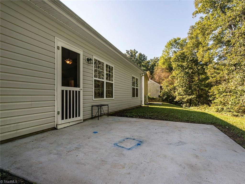 4705 Fewell Road Greensboro, NC 27405 - Photo 19 of 23 The patio area is great for entertaining.