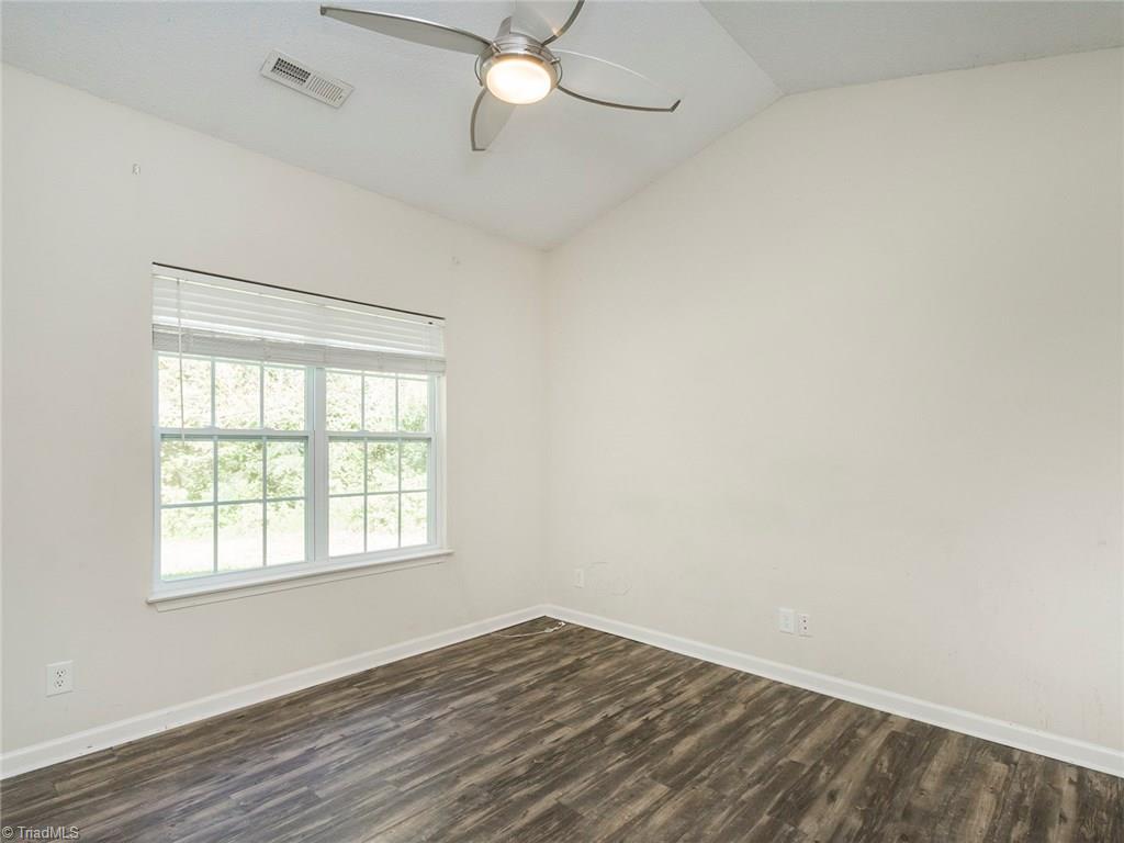 4705 Fewell Road Greensboro, NC 27405 - Photo 22 of 23 The split floor plan offers a great master with vaulted ceilings and master bath.