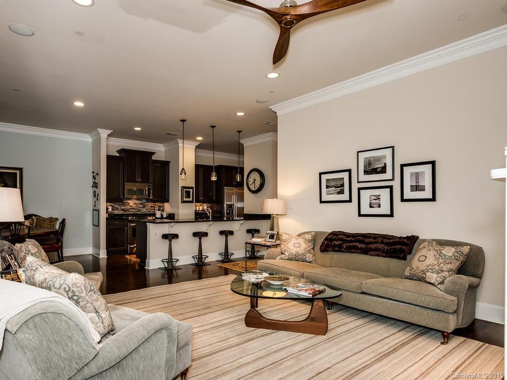 626 Queens Road, Unit 304 Charlotte, NC 28207 - Photo 13 of 24 a living room with furniture and kitchen view
