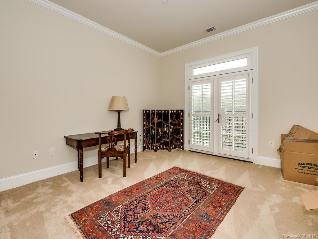 626 Queens Road, Unit 304 Charlotte, NC 28207 - Photo 14 of 24 a living room with furniture rug and window