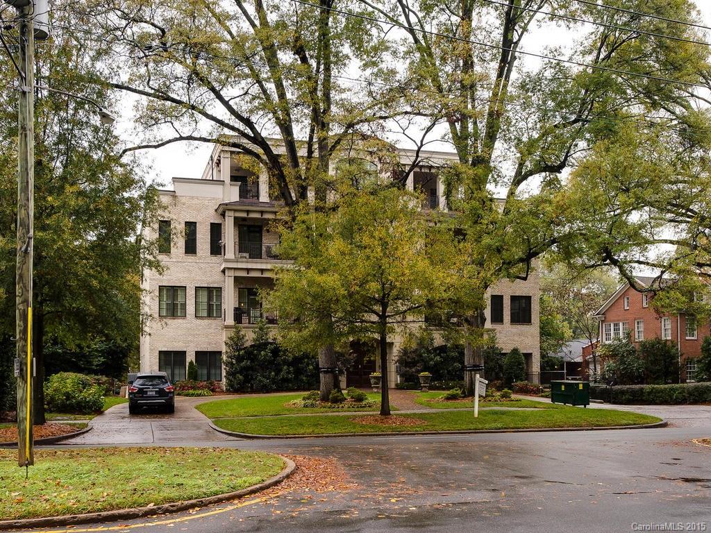 626 Queens Road, Unit 304 Charlotte, NC 28207 - Photo 16 of 24 a view of a big building in a big yard with large trees