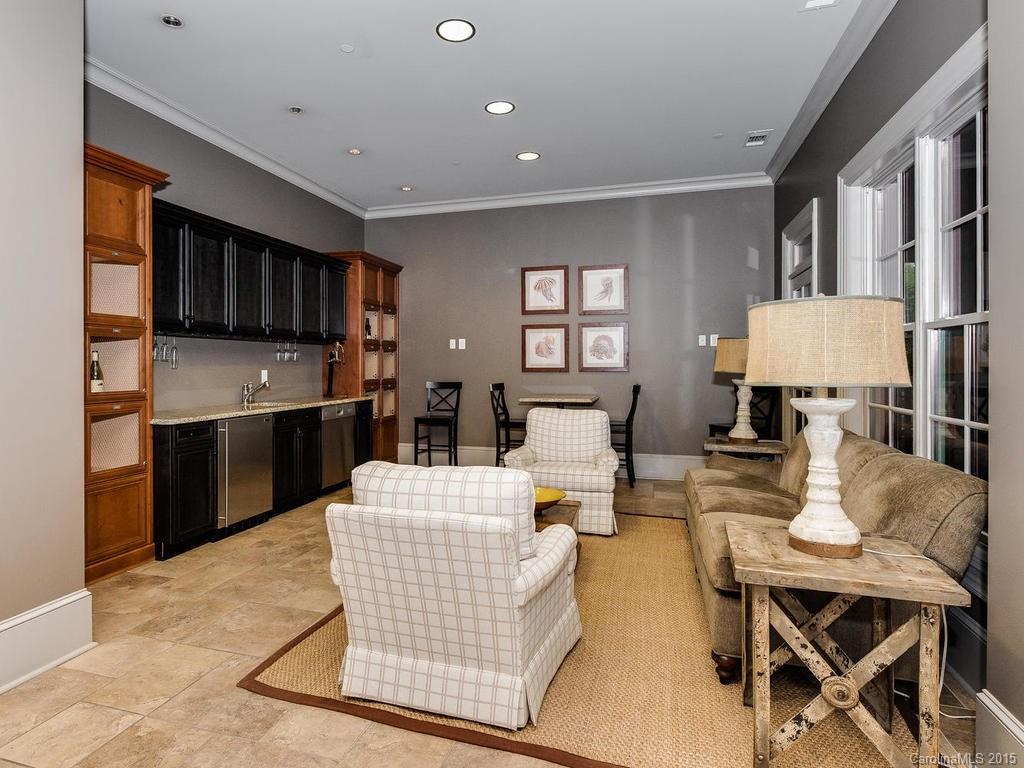 626 Queens Road, Unit 304 Charlotte, NC 28207 - Photo 19 of 24 a living room with fireplace furniture and a table