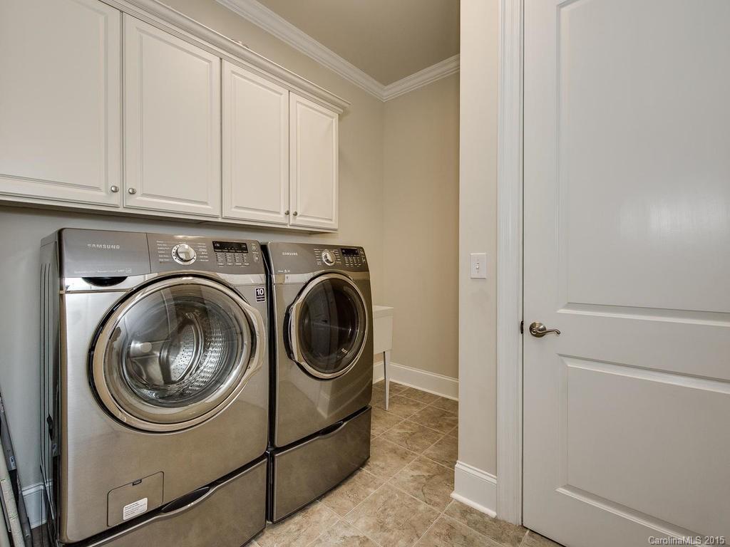 626 Queens Road, Unit 304 Charlotte, NC 28207 - Photo 22 of 24 a utility room with dryer and washer