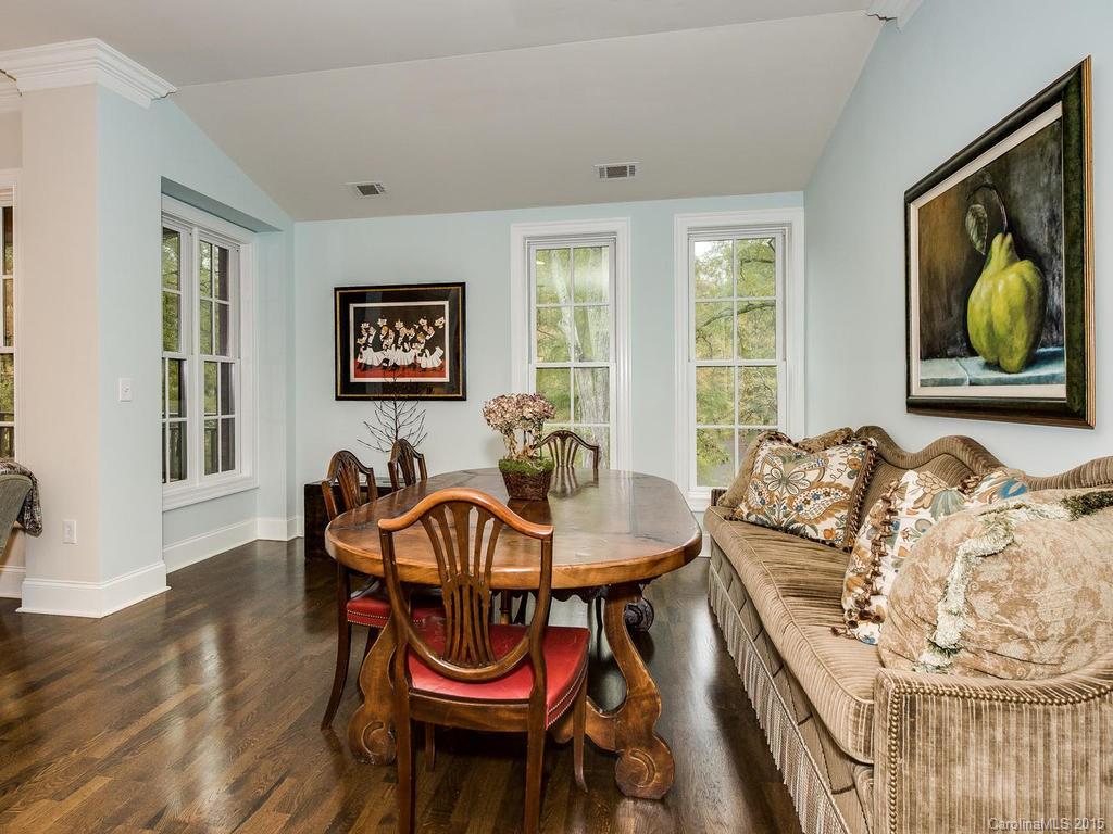 626 Queens Road, Unit 304 Charlotte, NC 28207 - Photo 4 of 24 a living room with furniture and a window