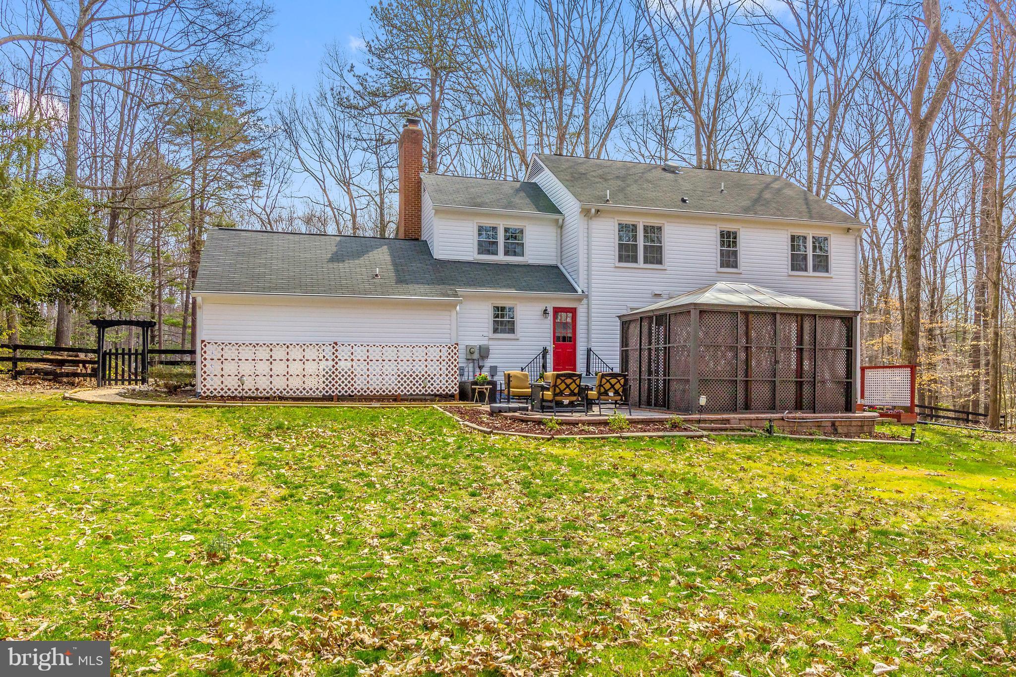 8040 Stillbrooke Road Manassas, VA 20112 - Photo 28 of 29 Back of home w/Patio, Hot Tub, Fenced Yard