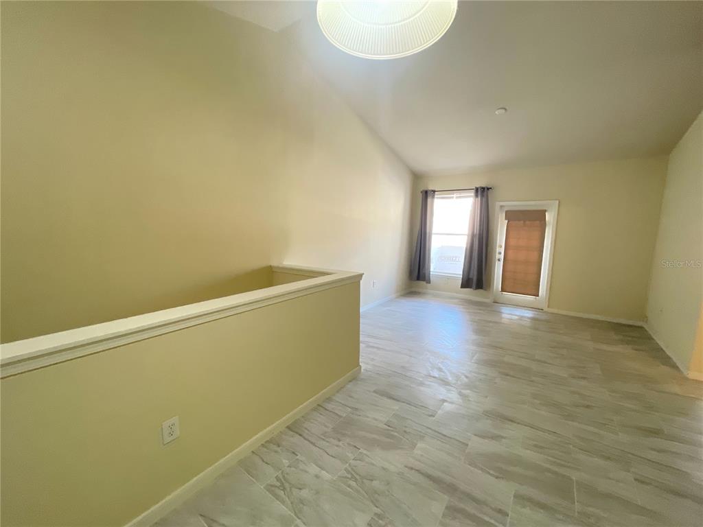 18108 Villa Creek Drive Tampa, FL 33647 - Photo 11 of 25 a view of a room with wooden floor