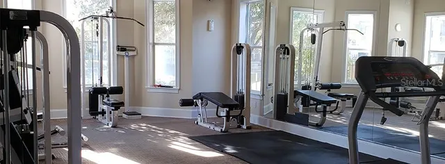 a view of a hallway with living room and furniture