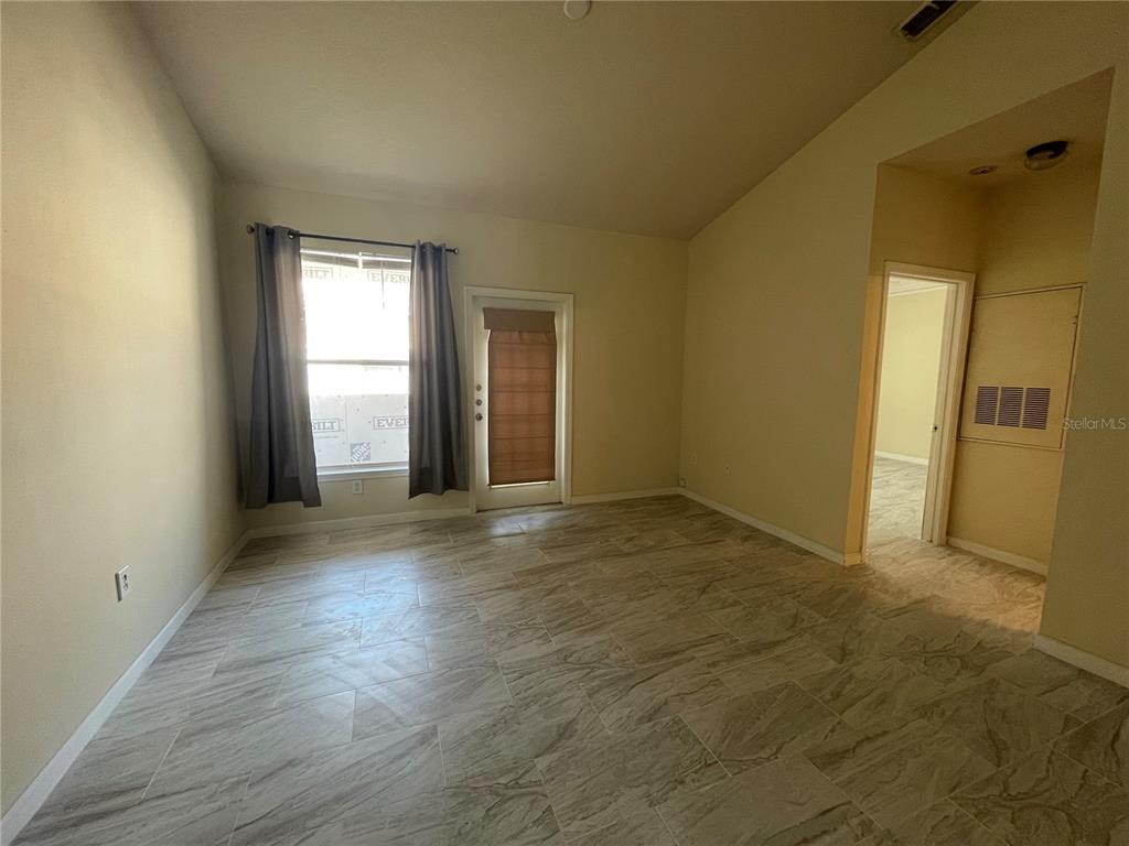 18108 Villa Creek Drive Tampa, FL 33647 - Photo 25 of 25 an empty room with windows and entrance