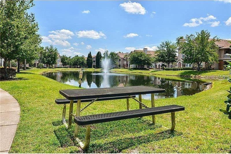 18108 Villa Creek Drive Tampa, FL 33647 - Photo 4 of 25 a view of a lake with a yard