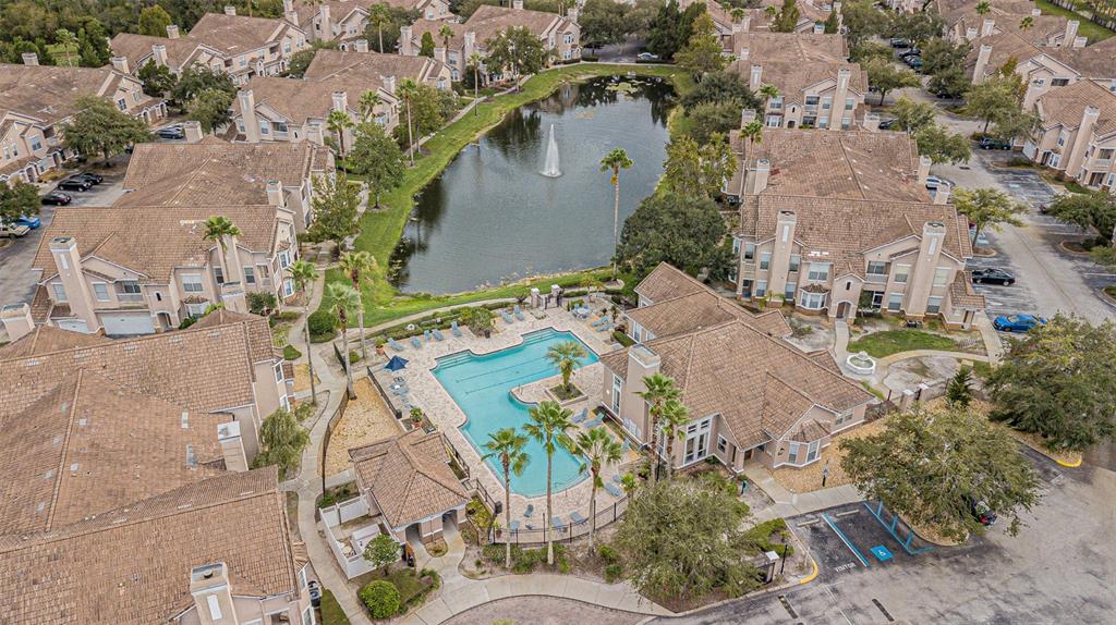 18108 Villa Creek Drive Tampa, FL 33647 - Photo 8 of 25 an aerial view of a house with a yard and large trees