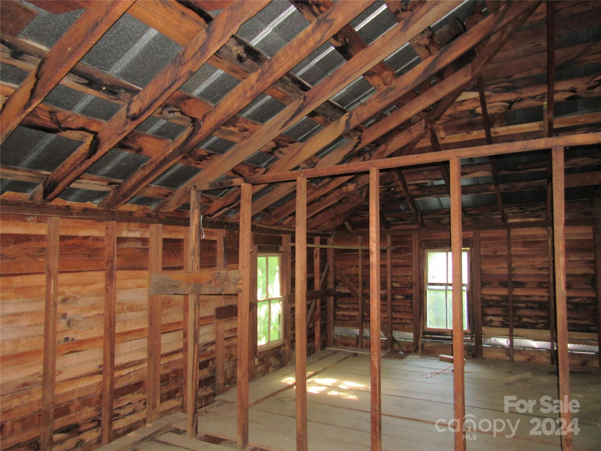 664 Woodfin Road Sylva, NC 28779 - Photo 26 of 34 a view of an empty room with wooden floor