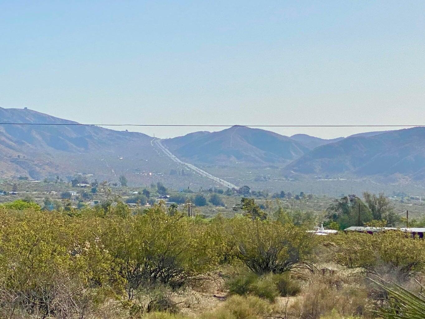 135 Bardell Road Morongo Valley, CA 92256 - Photo 22 of 29 a view of a town with mountains in the background