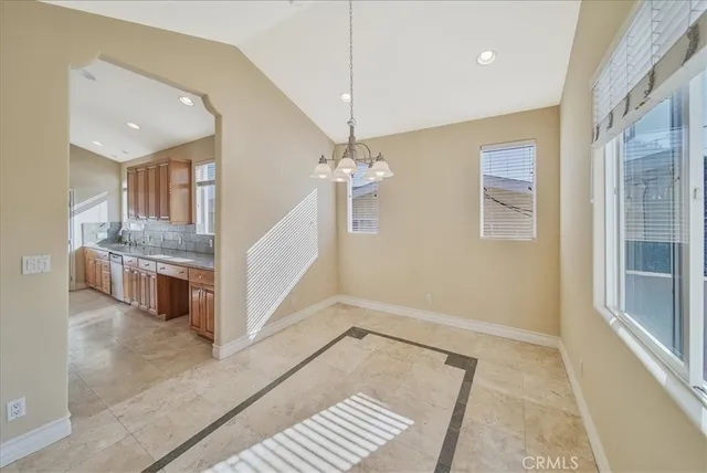 a view of a livingroom with a furniture wooden floor and a chandelier