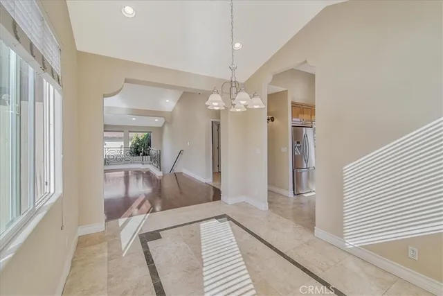 a view of a house with a wooden deck