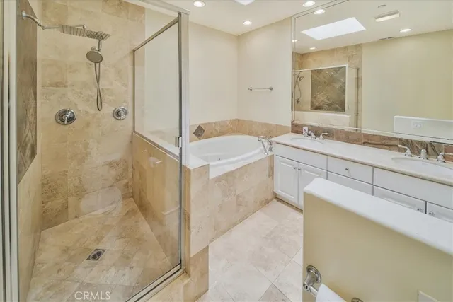 a bathroom with a tub and shower